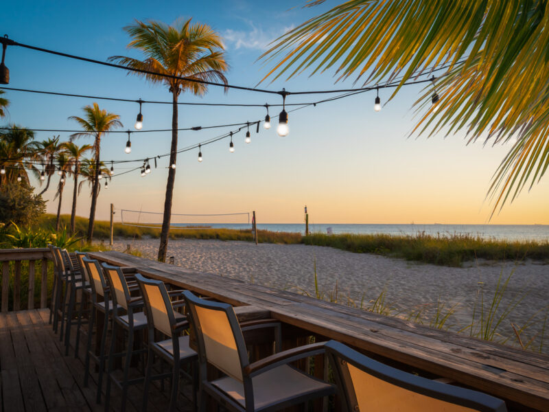 beachfront restaurants Destin Panama City Beach. Empty chairs at a beach bar.